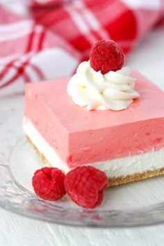 raspberry cream dream bars on a glass plate with the words raspberry cream dream bars