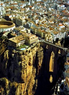 an aerial view of a city on the edge of a cliff