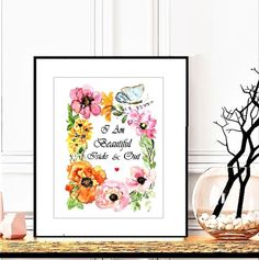 an image of a cross stitch pattern with flowers and butterflies in the frame on a table