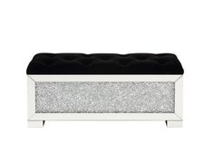 a black and white bench with silver glitter on the top, sitting in front of a white background