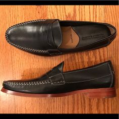 This Is A Sharp Looking Johnston & Murphy Loafer With A Black Leather Upper And Strap Across The Top Of The Shoe. There Is A Cushioned Insole With Good Arch Support. Nwot, Store Display Wear. Size 8.5m, Confirm Length Of 11.25 Inches. #Petfree #Smokefree Classic Black Slip-ons With Stitched Sole, Black Wingtip Moccasins With Branded Insole, Black Leather Footbed Wingtip Moccasins, Fitted Black Wingtip Loafers, Black Moccasins With Stitched Sole For Business Casual, Fitted Black Loafers With Brogue Detailing, Black Plain Toe Boat Shoes For Business, Black Slip-on Moccasins For Semi-formal Occasions, Semi-formal Black Slip-on Moccasins