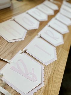 the table is set up with place cards for guests to write their names and numbers