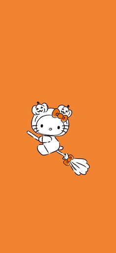 hello kitty flying on an orange background with the caption hello kitty is holding a broom