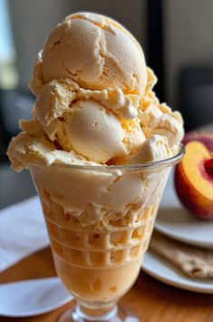 an ice cream sundae with peaches on the side