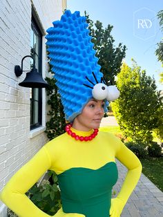 a woman in a costume made to look like a cartoon character with spikes on her head