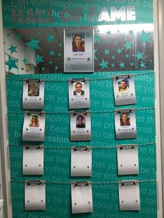 a bulletin board that has pictures on it with name tags attached to the front and sides