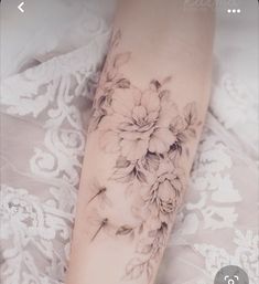 a woman's leg with flowers on it