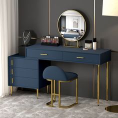 a desk with a mirror, stool and other items on it