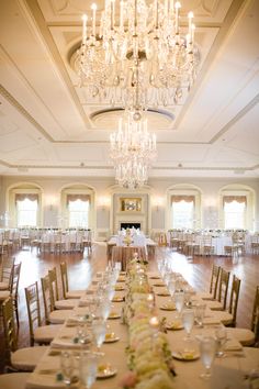 an elegant dining room with chandelier and tables set up for formal dinnereon