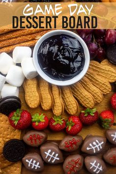 the dessert board has chocolate covered strawberries, cookies, and marshmallows