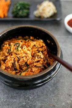 a close up of a bowl of food on a table