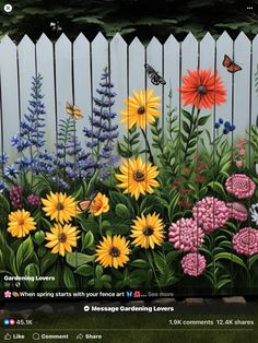 an image of flowers painted on the side of a fence with butterflies flying over them