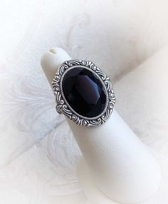 "CURRENTLY UNAVAILABLE! Small crystal ring 'Black Miracle' by Midnight Vision Jewelry Black oval crystal ring ideal for everyday wear. It features a beautiful black Czech crystal in a smaller aged silver ornated frame. The ring is sitting safely on a medieval influenced opened ring base as it is riveted on it. You can adjust it easily for your comfortable wear. * The metal parts are of high quality brass * Nickel and lead free * Complimentary gift wrapped * Smoke free household Dimensions: * The Jewel Choker, Black Crystal Ring, Ring Black Stone, Kohls Jewelry, Ornate Ring, Ring Everyday, Black Stone Ring, Swarovski Crystal Rings, Gothic Victorian