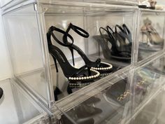 several pairs of high heeled shoes are on display