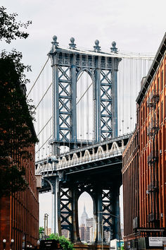 the bridge is very tall and can be seen from across the street in this photo