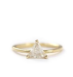 a yellow gold engagement ring with a princess cut diamond