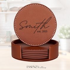 a personalized leather coaster sits on top of a table