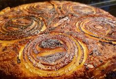 a cake that is sitting on top of a pan with some icing around it