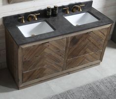 two white sinks sitting on top of a wooden cabinet