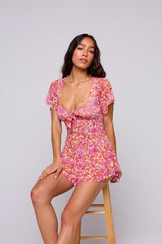 Get ready to romp around in style with the Romy Romper. This playful romper features a unique mesh design and a trendy high-low detail, perfect for standing out in any crowd. Casual Bubble Romper With Floral Print For Spring, Casual Floral Print Bubble Romper For Spring, Casual Pink Floral Print Bubble Romper, Casual Fitted Bubble Romper With Short Sleeves, Fitted Short Sleeve Casual Bubble Romper, Casual Fitted Short Sleeve Bubble Romper, Floral Print Mini Jumpsuits And Rompers For Day Out, Playful Fitted Short Sleeve Jumpsuits And Rompers, Playful Fitted Short Sleeve Jumpsuit