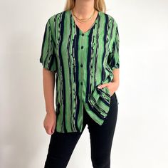 Relaxed, loose arty stripe print ladies shirt with a collar-less v-neck, side slits and short sleeves. Made from breathable, crinkled viscose in beautiful, juicy apple green and black. Large size, works as oversized, too. Worn in photos by 176cm tall, size 12UK. Perfect for a relaxed look over leggings or tied short to go with denim shorts. Made by Berkertex. 100% viscose. Medium size, labelled as 12UK. Measurements when laid flat are: Pit to pit: 56cm Waist: 56cm Length: 75cm Excellent conditio Stripe Blouse, Ladies Shirt, Green Shirt, Apple Green, Green And Black, Striped Blouse, 90s Vintage, Stripe Print, Black Green