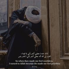 a person leaning against a door with their head in his hands and an arabic quote on it