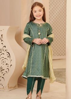 3- Piece Embroidered Suit for Girls A dark green and gold cotton jacquard kurta with intricate adda work detailing on the neck and a hand made tassels tied, is finished off lovingly with gold laces. Paired with dark green cotton tulip pants with gold lace work and a dull gold crush dupatta, this mesmerizing number is the perfect addition for your little ones wardrobe this season. Description : Top: Dark Green Cotton Jacquard Kurta with Hand Adda Work, Lace Work and Tassels Bottom: Dark Green Cot Girl Green Dress, Tulip Pants, Embroidered Suit, Kurta Dress, Green Girl, Modest Wear, Gold Lace, Family Outfits, Green Cotton