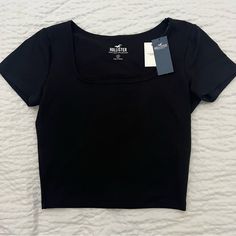 Black Ribbed Square Neck Tee Basic Top To Match With Absolutely Anything! Super Soft Baby Tee Is Made With Seamless Rib Fabric Featuring A Square Neckline And Short Sleeves 88% Polyester, 12% Elastane Square Neck Ribbed Fitted Crop Top, Black Square Neck Tank Top, Hollister Square Neck Top, Black Square Neck Top In Elastane, Eminem Daughter, Black Fitted Y2k Cropped T-shirt, Rib Fabric, Square Neck Top, Hollister Tops