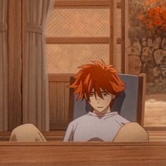 an anime character sitting in a chair with his feet up on the table and looking at something