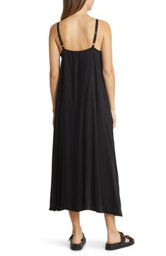 This simple A-line maxi is crafted in a sleeveless silhouette with a modern square neckline and handy side pockets. 45" center front length (size Medium) Square neck Adjustable straps Sleeveless Side pockets Lined 58% cupro, 42% viscose Machine wash, line dry Imported Black Sleeveless Unlined Midi Dress, Chic Black Unlined Maxi Dress, Chic Unlined Black Maxi Dress, Black Maxi Dress With Straight Neckline For Summer, Black Square Neck Sundress Maxi Dress, Black Maxi Slip Dress With Adjustable Straps, Black Maxi Dress With Adjustable Straps, Chic Black Dresses With Slip Pockets, Chic Black Dress With Slip Pockets