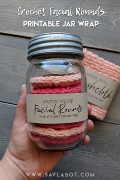 a hand holding a jar filled with crochet facial rounds printable jar wrap