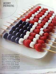 an advertisement for berry patriotic skewers on a plate