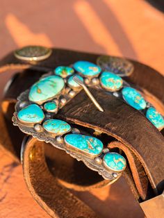 One of my favorite things to design, sterling silver and American turquoise "Ranger" buckles are inspired, artful creations. They look amazing with our vintage latigo belts or Wild West turquoise concho belts. This set is unique that it has a top, keeper, and A beautiful combination including natural Piolet Mountain and Royston turquoise. Our On the Range finish 3.5 to 4 inch size range. Please contact me for availability and pricing. I do my best to keep these in production, but often times hav Handmade Adjustable Western Belt Buckles, Vintage Adjustable Turquoise Belt, Adjustable Vintage Turquoise Belt, Adjustable Turquoise Vintage Belt, Vintage Turquoise Belt With Concho, Bohemian Concho Belt Buckles For Western-themed Events, Turquoise Bohemian Belt With Concho, Southwestern Turquoise Concho Belt Buckles, Western Turquoise Belt With Concho