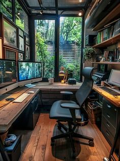 a home office with multiple computer screens and desks