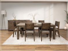 a dining room table and chairs in front of a white wall