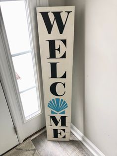 a welcome sign in front of a door