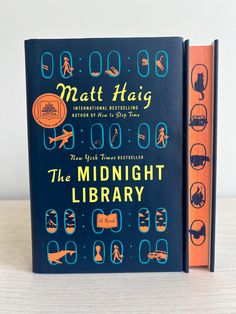 the midnight library by matt haig is shown in front of an orange and blue book