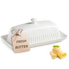 a butter dish with a tag that says fresh butter