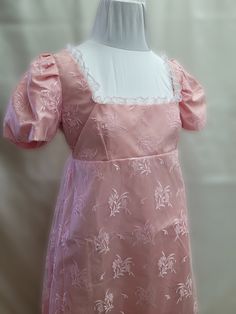 This dress has free standard shipping included!  Standard shipping Air Mail, no tracking.  If you would like Express Post or place by place tracking, please contact us, and we can set that up for you!   We offer a basic Regency styled gown, with the empire waist and short puffed sleeves.  This stunning dress has a light pink lace overlay and is trimmed with dainty white lace along the neckline. Top and sleeves are lined.     *This gown ties at the back with ribbons which can adjust the fit. Regency Dress Jane Austen, Bridgerton Daphne, Jane Austen Emma, Bridgerton Dresses, Regency Core, Regency Dresses, Regency Dress, Queen Charlotte, Puffed Sleeves