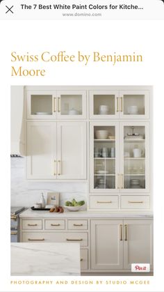 a white kitchen with lots of cupboards and dishes on it's front cover