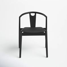 a black chair on a white background with no one in the room to see it