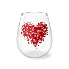 a wine glass filled with lots of red hearts