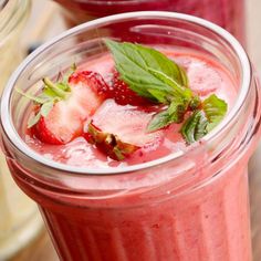 two glasses filled with strawberry smoothie and mint garnish