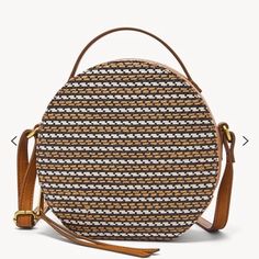 Material: 72% Polyethylene, 28% Jute/Polyurethane Trim Interior Material: 100% Polyester Interior Details: 3 Credit Card Slots Measurements: 7.5" L X 2.75" W X 7.75" H Silhouette: Canteen Handle Strap Description: 1 Adjustable Crossbody Strap, 1 Top Handle Platform: Courtney Primary Color: Multi Hardware: Old English Brass Grab Drop: 1.375" Handles Shoulder Drop: 26.5" Strap When Fully Extended Closure: Zipper Additional Product Features: Vegan Fossil Crossbody Bags, Brown Crossbody, Fossil Bags, Handbag Straps, Brown Bags, Colored Leather, Small Crossbody Bag, Old English, Bag Organization