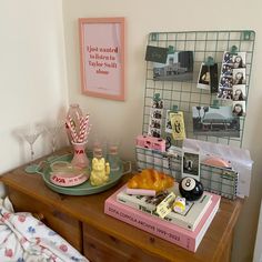 a bed room with a neatly made bed and some food on the top of it