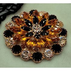 This Stunning Vintage Brooch By Eisenberg Ice Features A Beautiful Layered Design With Prong-Set Black, Orange, And Clear Rhinestones. The Marquise And Round Shaped Stones Are Arranged In A Flower Shape, Giving The Piece A Timeless Elegance. This Brooch Is Signed By Eisenberg And Is Made Of Yellow Gold Plated Metal. At 2 1/8" In Length, This Vintage Piece Is A Perfect Addition To Any Jewelry Collection. It Is In Excellent Condition And Has Been Well-Preserved Over The Years. The Intricate Detailing And Use Of High-Quality Materials Make This Brooch A True Work Of Art. It Is A Must-Have For Any Collector Of Vintage Jewelry. Please Feel Free To Ask Questions. (*Jw20-Et) Orange Brooch Jewelry For Party, Layered Design, Vintage Brooch, Layers Design, Clear Rhinestones, Black Orange, Flower Shape, A Flower, Vintage Brooches