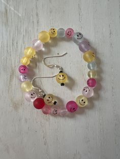 Original and handmade Multicolor Happy Face bead by bead stretch bracelet!  Made with glass. Handmade Casual Glass Bracelets, Casual Handmade Glass Bracelets, Casual Handmade Glass Bracelet, Fun Adjustable Beads For Gifts, Cheerful Handmade Adjustable Beaded Bracelets, Cheerful Multicolor Beaded Bracelets For Friendship, Cheerful Multicolor Beaded Friendship Bracelets, Cheerful Handmade Multicolor Bracelets, Cheerful Multicolor Round Beads Bracelets