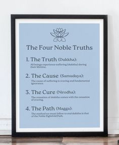 the four noble truths poster in front of a white wall with a black frame