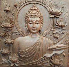 a buddha statue sitting in front of flowers