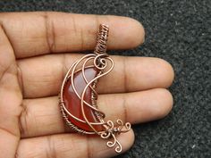 You will receive One Carnelian Moon Pendant Wire Wrapped copper pendant Gemstone Healing Jewelry Filigree Art Wire Wrap Pendant Necklace For Her Beautiful gift . Pendant Size: 43 mm long include bail. Many thanks for you visit my store ♥ if you have any question please contact us. For wholesale Price Please Convo me. You can order different items as many you like . Copper Jewelry With Moon Charm For Gift, Orange Copper Wire Jewelry As A Gift, Orange Copper Wire Jewelry For Gifts, Copper Moon Charm For Jewelry Making, Crescent Copper Jewelry As Gift, Crescent Copper Jewelry Gift, Crescent Copper Jewelry For Gift, Unique Crescent Shaped Copper Jewelry, Art Wire